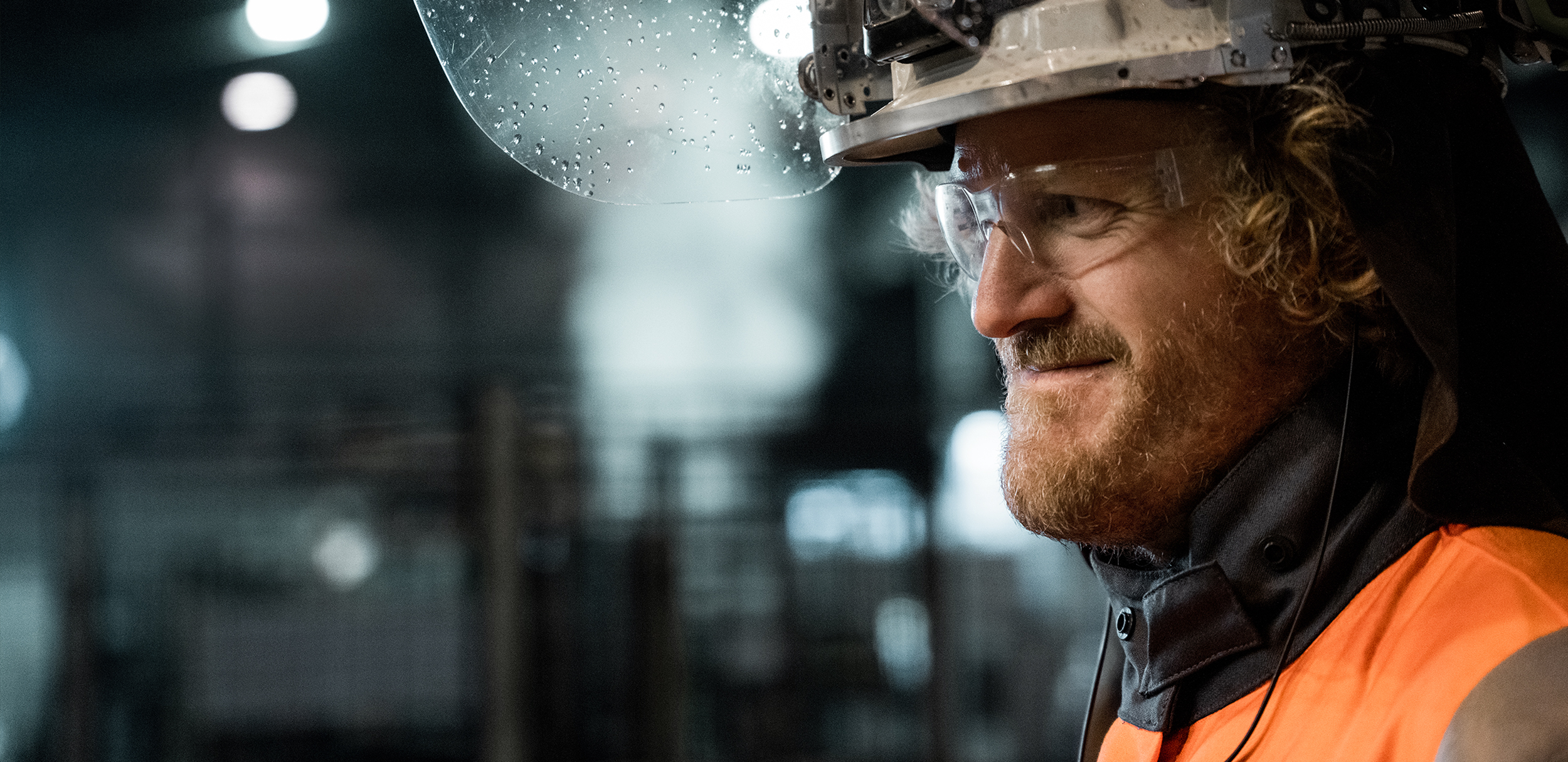 a man wearing a hard hat and goggles