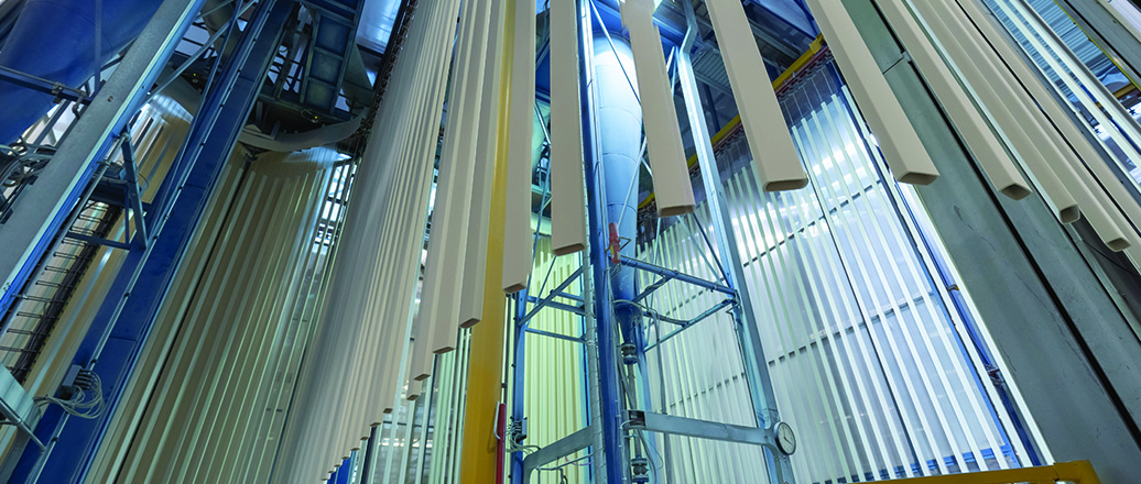 a group of people walking down a hall way