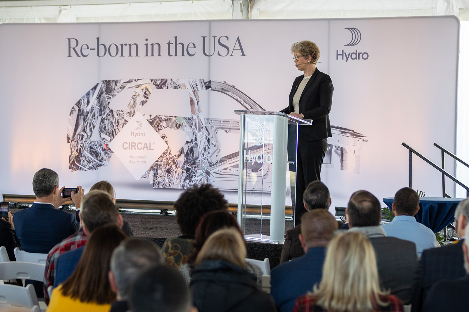 a person standing in front of a crowd of people