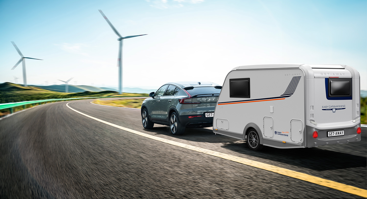 a car and a caravan on a road