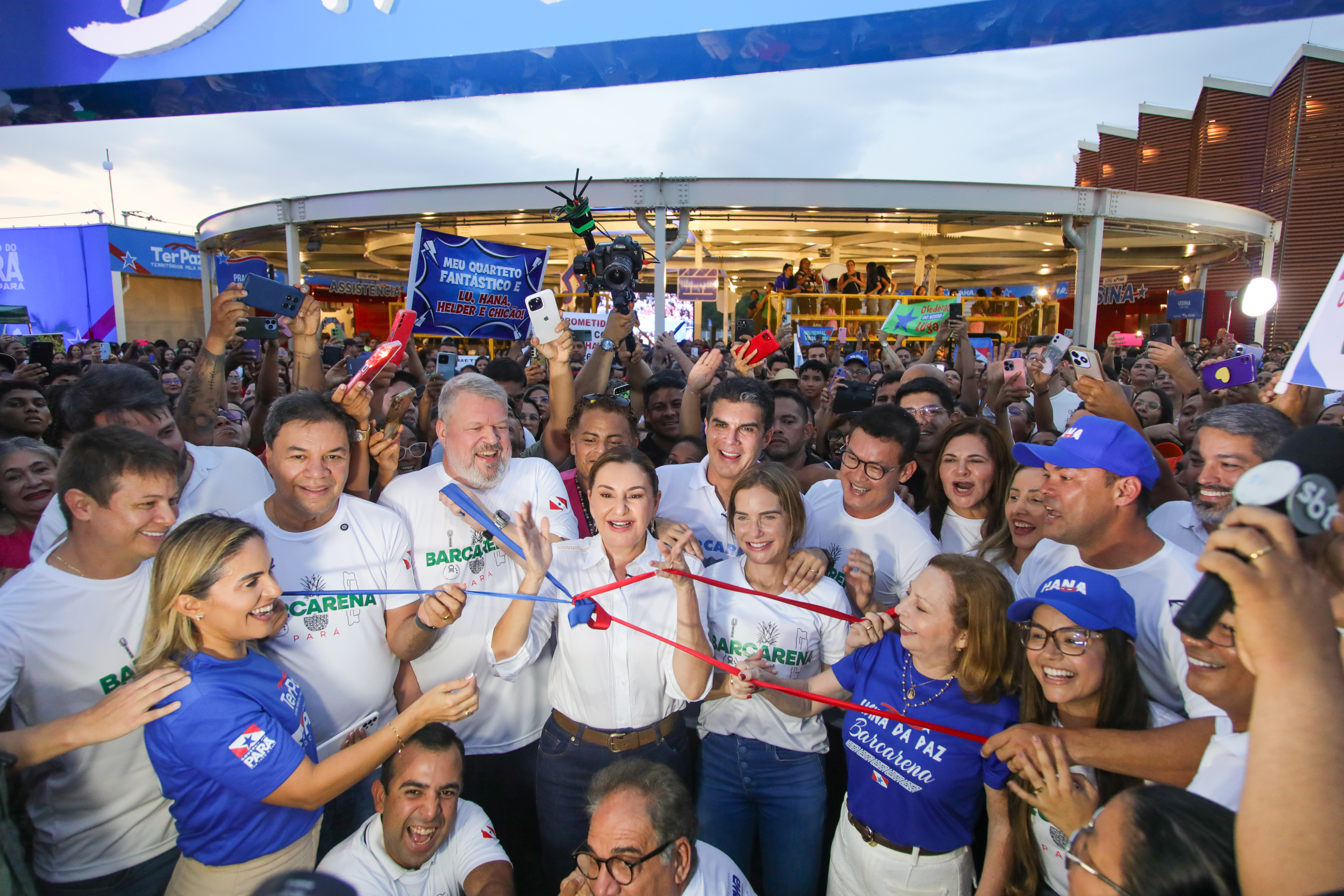 a group of people in white shirts