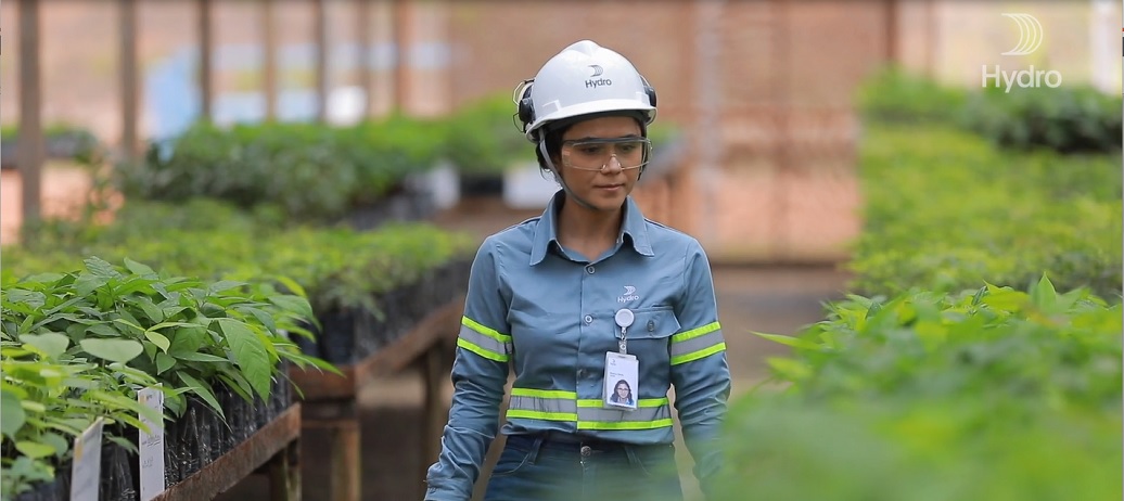 Hydro employee walks watching the seedlings of the company's nursery in Paragominas, Pará