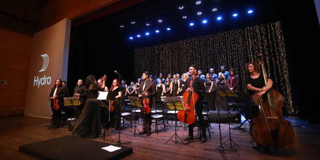 string players on a stage