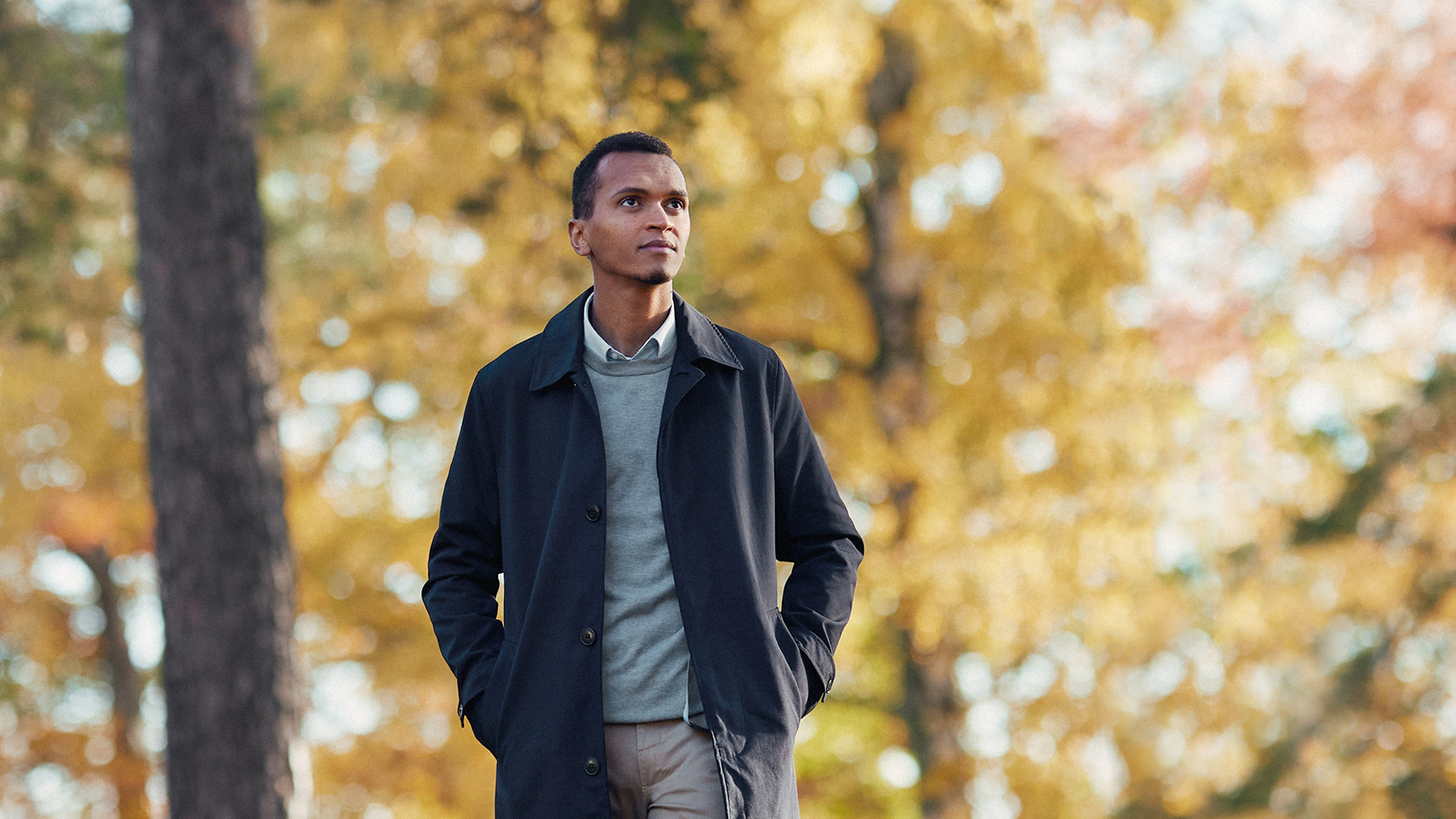 a person standing in front of trees