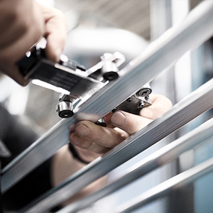 close-up of hands holding a small toy