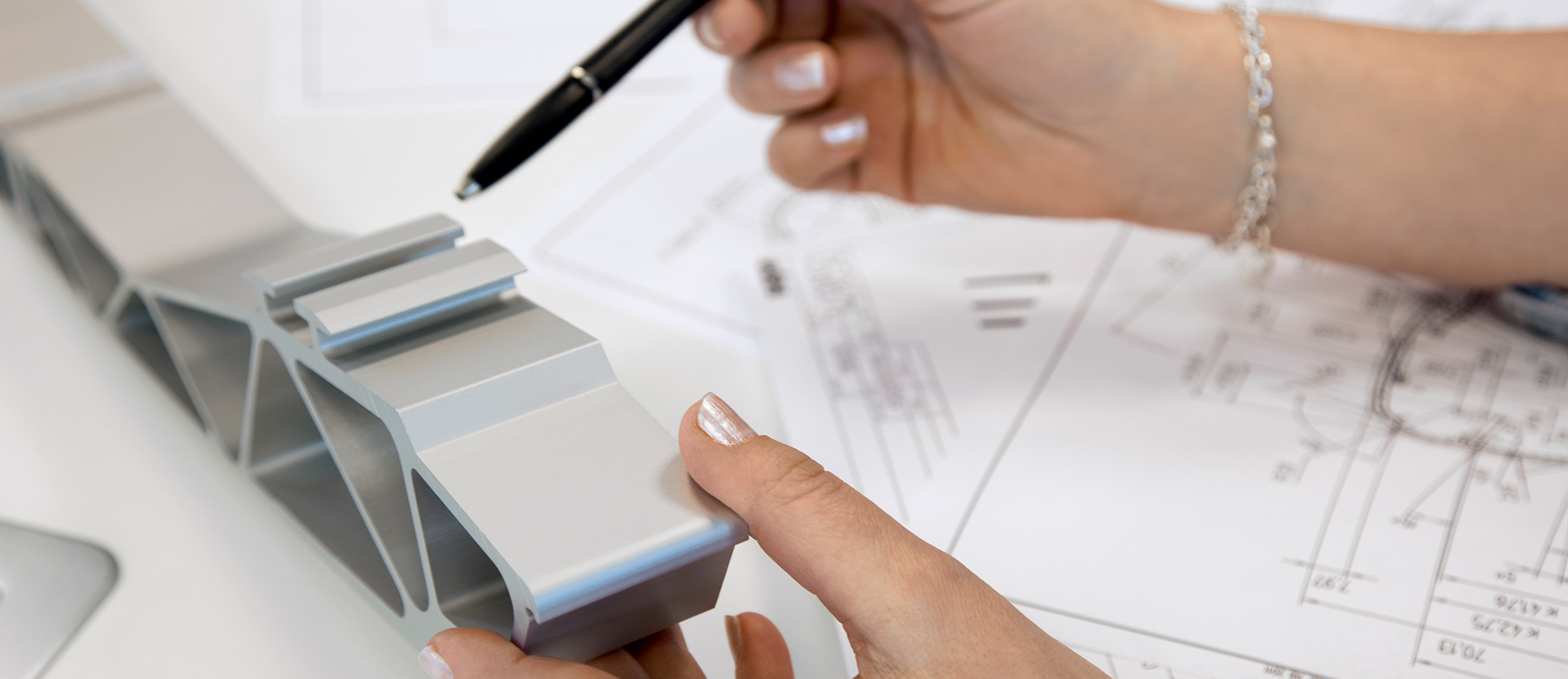 hands holding an extruded object